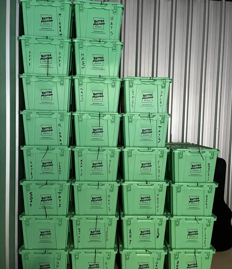 Removal crates stacked high up in storage container